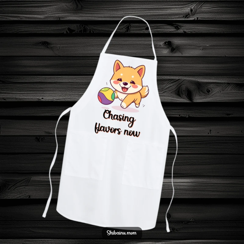 Funny Kawaii Shiba Inu apron showing a cheerful puppy intently chasing a colorful bouncing ball while cooking, adding humor to the kitchen.