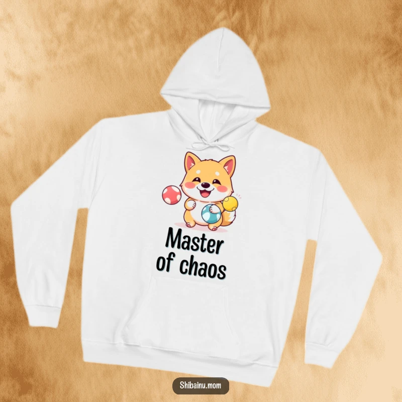 Funny Shiba Inu Hoodie: A happy Shiba Inu juggles three colorful balls with impressive coordination and a joyful demeanor.