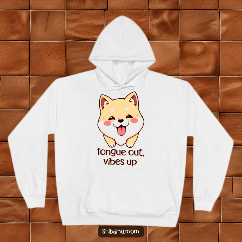 Funny Shibainu hoodie showcasing a cute dog face with tongue out, offering warmth and hilarious charm.