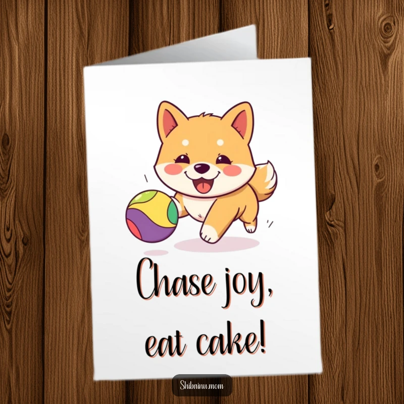 Funny free printable Kawaii Shiba Inu puppy card, joyfully chasing a bright bouncing ball, ready for a birthday surprise.